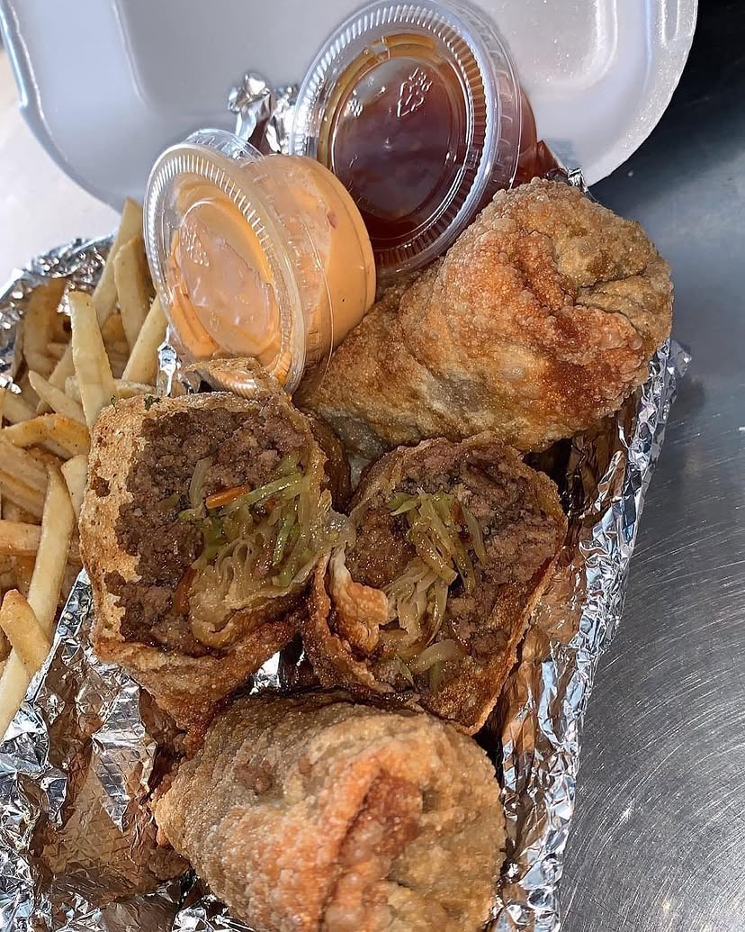 Loaded ground beef egg rolls with fries and sauces