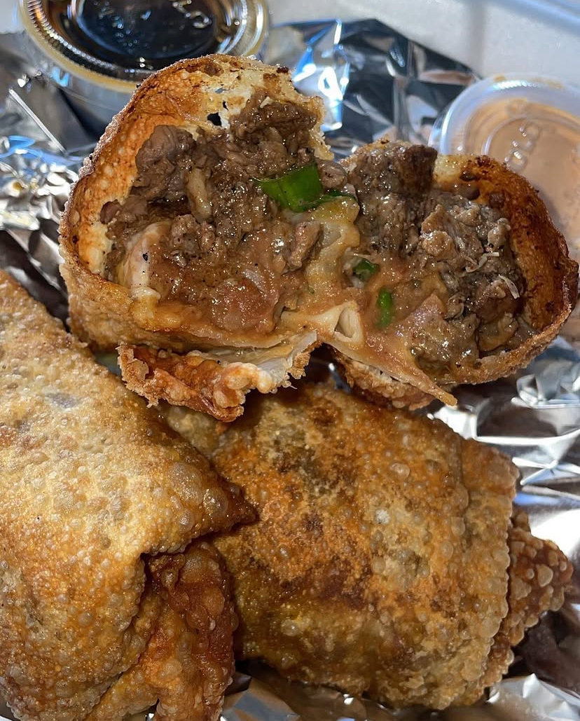 Steak and cheese egg roll cut open